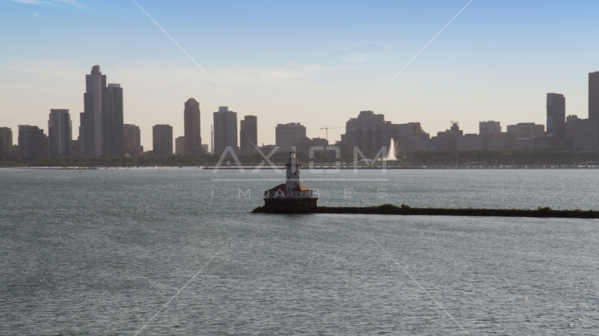 The Chicago Harbor Lighthouse with the Downtown Chicago skyline in the background, Illinois Aerial Stock Photo AX0002_047.0000079F | Axiom Images