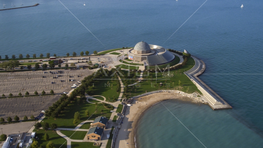 The Adler Planetarium and Astronomy Museum by Lake Michigan in Chicago, Illinois Aerial Stock Photo AX0002_085.0000202F | Axiom Images