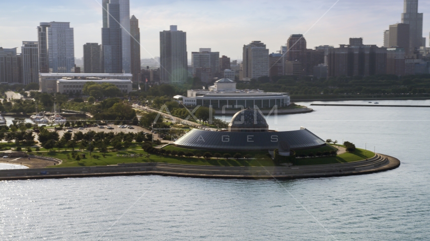 The Adler Planetarium and Astronomy Museum, Downtown Chicago in the background, Illinois Aerial Stock Photo AX0002_087.0000041F | Axiom Images