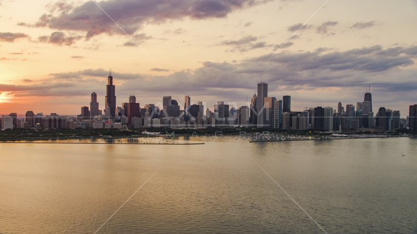 The Downtown Chicago skyline at sunset seen from Lake Michigan, Illinois Aerial Stock Photo AX0003_030.0000193F | Axiom Images
