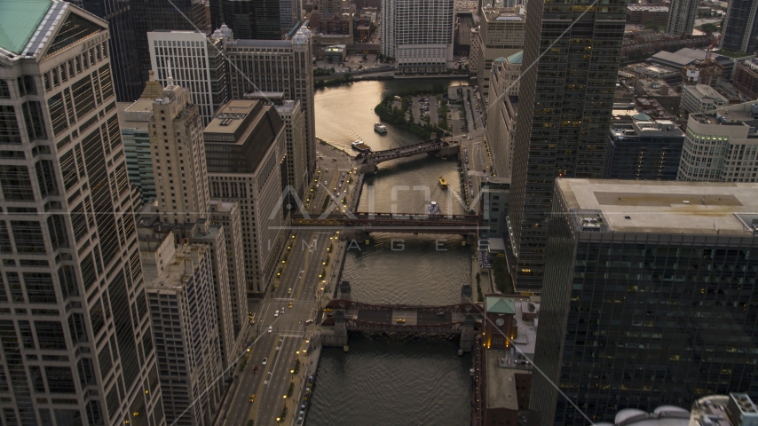 Bridges spanning the Chicago River through downtown at sunset, Downtown Chicago, Illinois Aerial Stock Photo AX0003_039.0000226F | Axiom Images