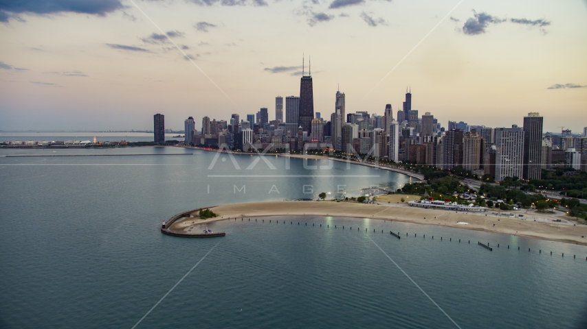 North Avenue Beach and Downtown Chicago skyline at twilight, Illinois Aerial Stock Photo AX0003_072.0000303F | Axiom Images