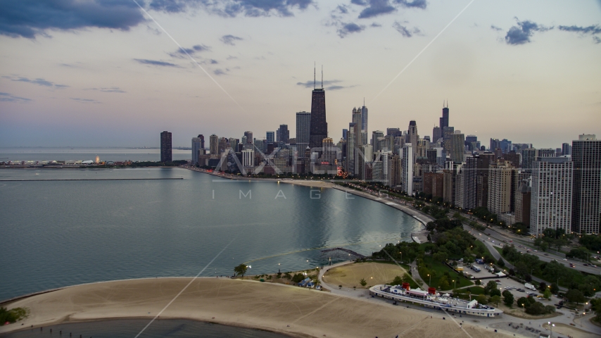 The skyline of Downtown Chicago seen from North Avenue Beach at twilight, Illinois Aerial Stock Photo AX0003_073.0000132F | Axiom Images