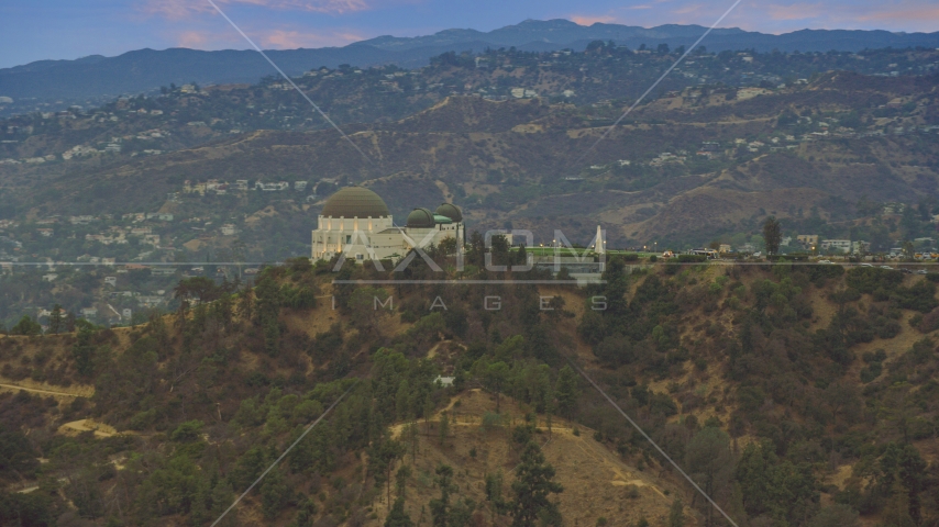 Griffith Observatory at twilight against the hills, California Aerial Stock Photo AX0158_006.0000241 | Axiom Images
