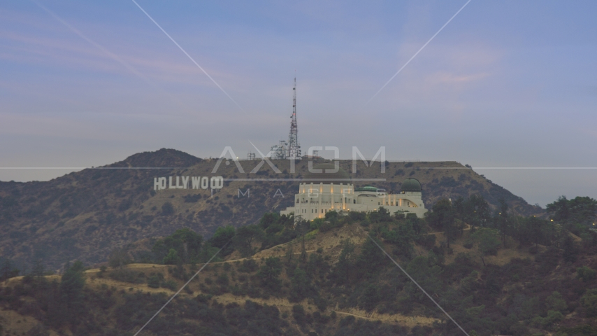 Griffith Observatory and Hollywood Sign at twilight, Los Angeles, California Aerial Stock Photo AX0158_008.0000386 | Axiom Images
