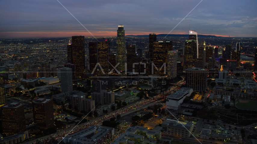 Tall skyscrapers at twilight in Downtown Los Angeles, California Aerial Stock Photo AX0158_051.0000214 | Axiom Images