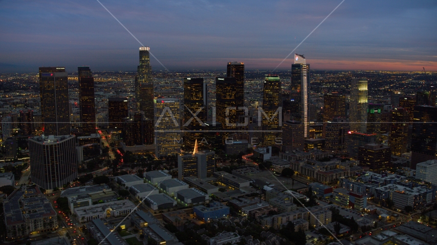 A view of skyscrapers at twilight in Downtown Los Angeles, California Aerial Stock Photo AX0158_052.0000310 | Axiom Images
