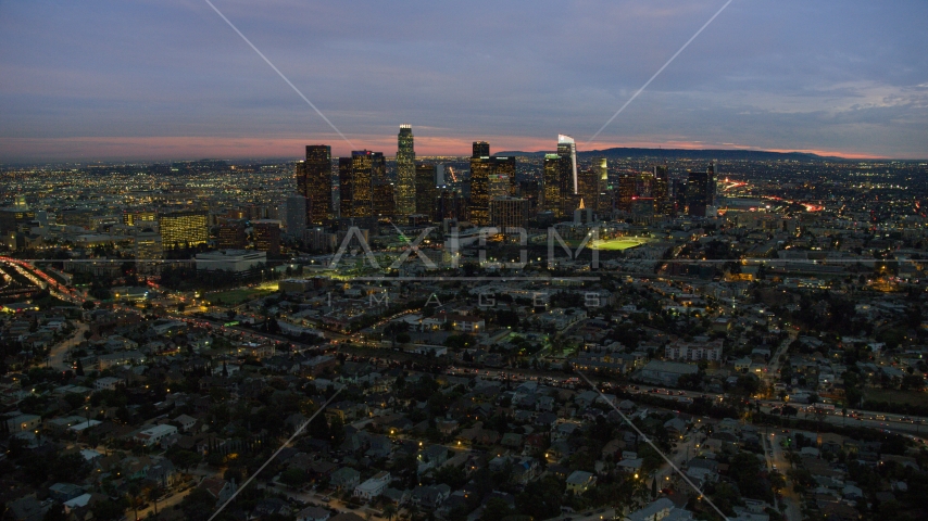 The Downtown Los Angeles, California skyline seen from Echo Park Lake at twilight Aerial Stock Photo AX0158_056.0000456 | Axiom Images