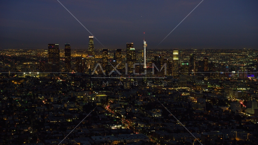 The tall towers of the Downtown Los Angeles skyline, California at night Aerial Stock Photo AX0158_072.0000199 | Axiom Images