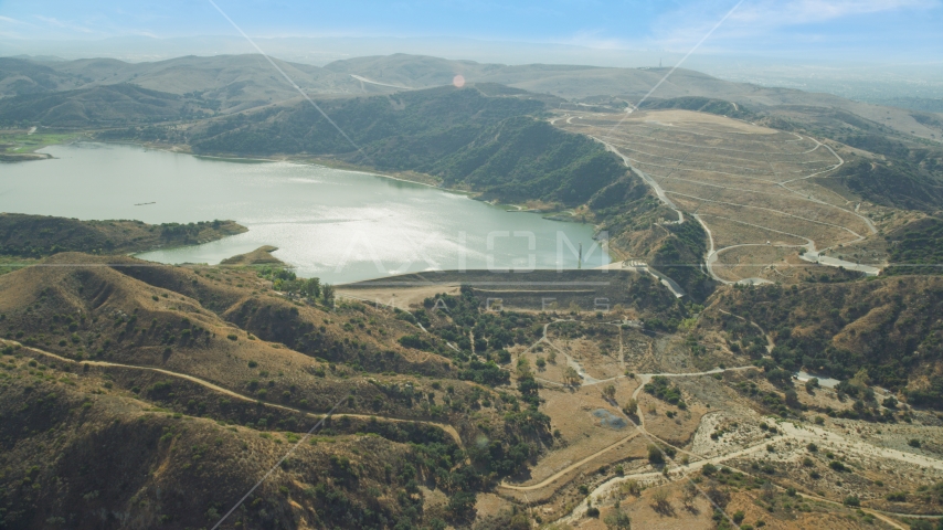A dam and Irvine Lake, Orange, California Aerial Stock Photo AX0159_161.0000000 | Axiom Images