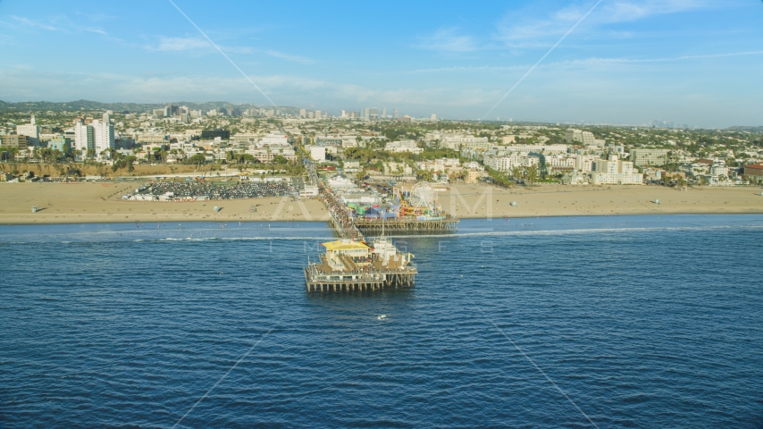 Santa Monica Pier and beach seen from the ocean, Santa Monica, California Aerial Stock Photo AX0161_079.0000129 | Axiom Images