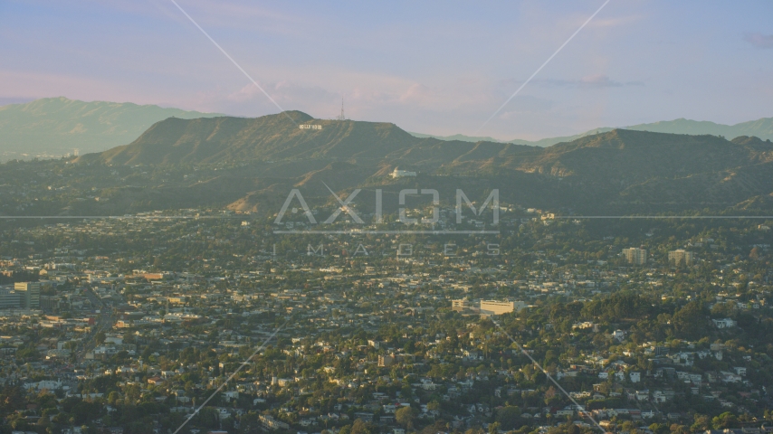 Hollywood Sign and Griffith Observatory seen from Silver Lake, California Aerial Stock Photo AX0162_043.0000126 | Axiom Images