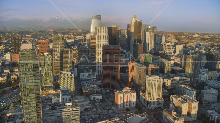 Skyscrapers at sunset in Downtown Los Angeles, California Aerial Stock Photo AX0162_070.0000088 | Axiom Images