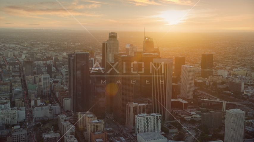 The tall towers of downtown at sunset in Downtown Los Angeles, California Aerial Stock Photo AX0162_086.0000142 | Axiom Images