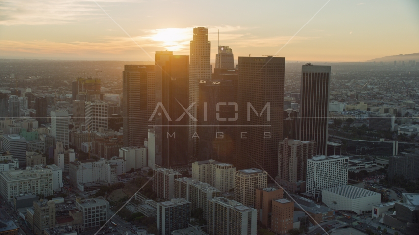 Tall city skyscrapers of downtown at sunset in Downtown Los Angeles, California Aerial Stock Photo AX0162_088.0000000 | Axiom Images