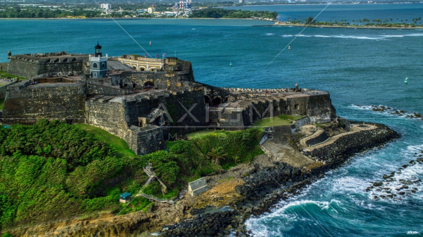 Historic fort along the coast with clear blue water, Old San Juan Puerto Rico Aerial Stock Photo AX101_012.0000125F | Axiom Images