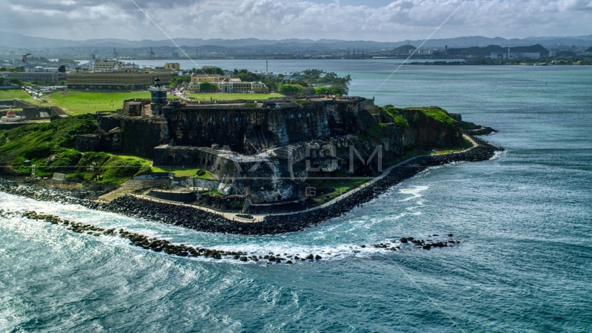 Historic fort along the coast of clear blue water, Old San Juan Puerto Rico Aerial Stock Photo AX101_013.0000148F | Axiom Images