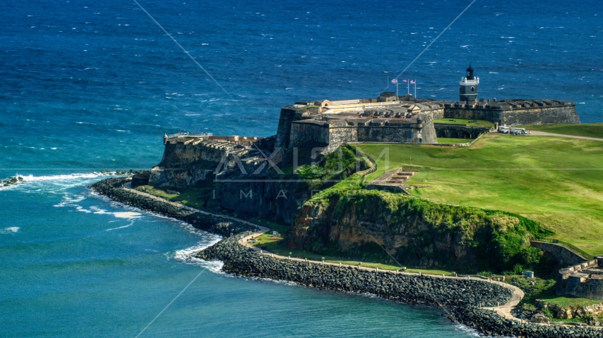 Historic fort on the coast by the blue waters of the Caribbean, Old San Juan, Puerto Rico Aerial Stock Photo AX101_018.0000000F | Axiom Images
