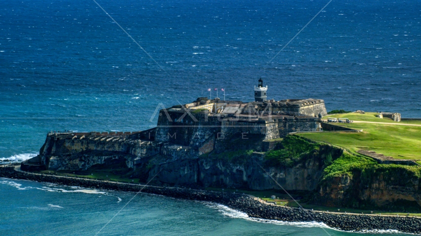 Castillo San Felipe del Morro by blue Caribbean waters, Old San Juan, Puerto Rico Aerial Stock Photo AX101_019.0000203F | Axiom Images