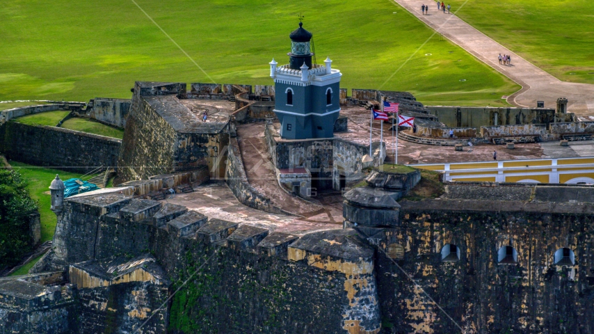 Historic Caribbean fort and lighthouse, Old San Juan, Puerto Rico Aerial Stock Photo AX101_023.0000208F | Axiom Images
