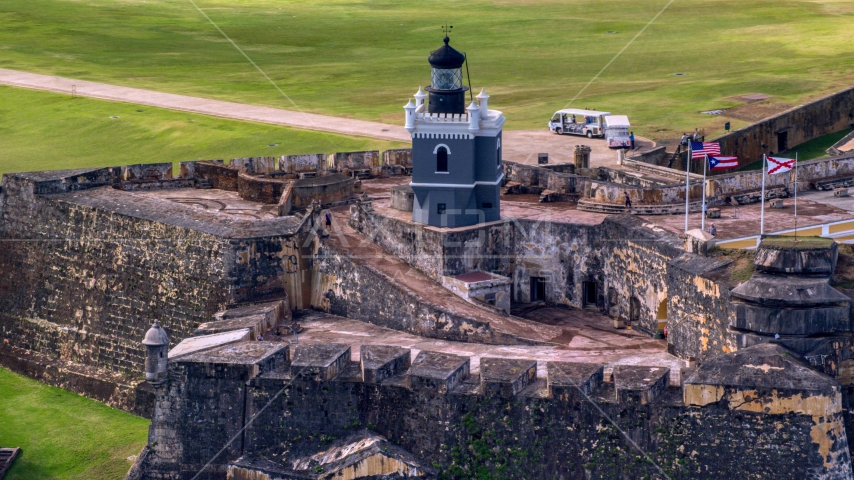 Historic fort and lighthouse, Old San Juan Puerto Rico Aerial Stock Photo AX101_024.0000203F | Axiom Images