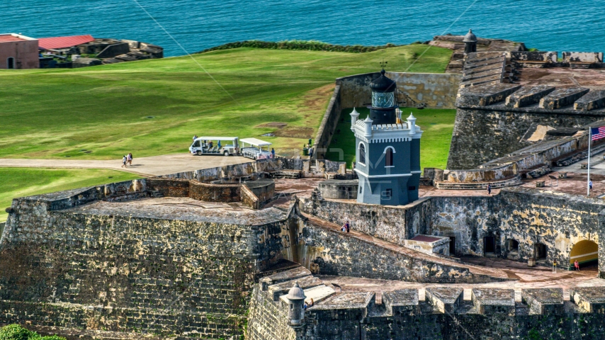 Historic fort and lighthouse in Old San Juan, Puerto Rico Aerial Stock Photo AX101_025.0000152F | Axiom Images