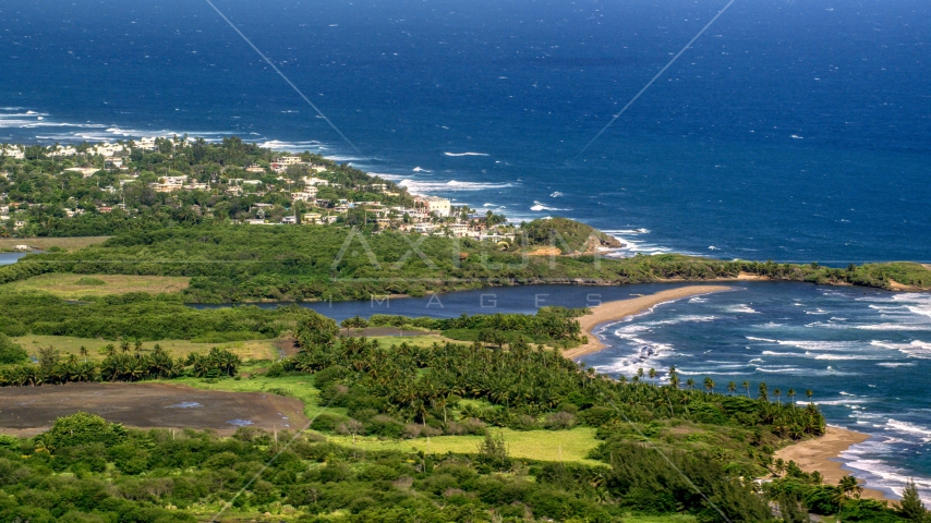 A resort town by the blue Caribbean coastal waters, Dorado, Puerto Rico Aerial Stock Photo AX101_031.0000267F | Axiom Images