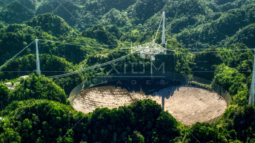Arecibo Observatory dish and Karst forest, Puerto Rico Aerial Stock Photo AX101_095.0000000F | Axiom Images