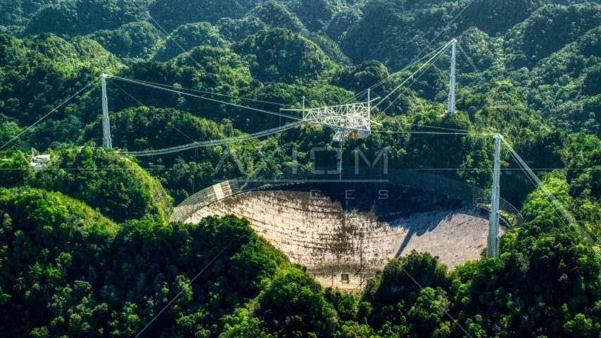 Arecibo Observatory in lush green Karst forest, Puerto Rico  Aerial Stock Photo AX101_096.0000000F | Axiom Images