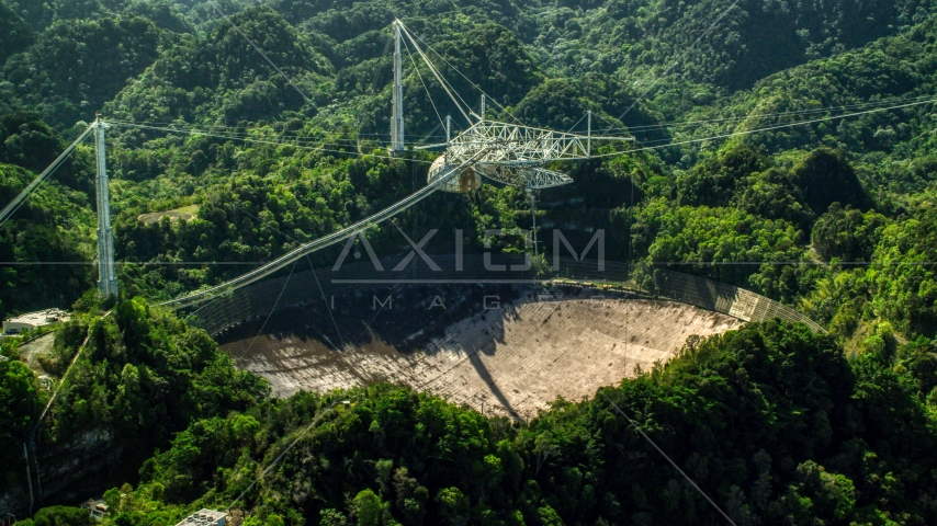 Arecibo Observatory surrounded by Karst Forest trees in Puerto Rico  Aerial Stock Photo AX101_106.0000000F | Axiom Images