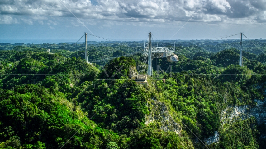 A view over lush jungle of the Arecibo Observatory, Puerto Rico Aerial Stock Photo AX101_110.0000247F | Axiom Images