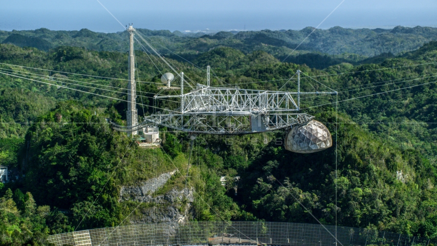 Top of the Arecibo Observatory and lush green trees, Puerto Rico  Aerial Stock Photo AX101_113.0000000F | Axiom Images