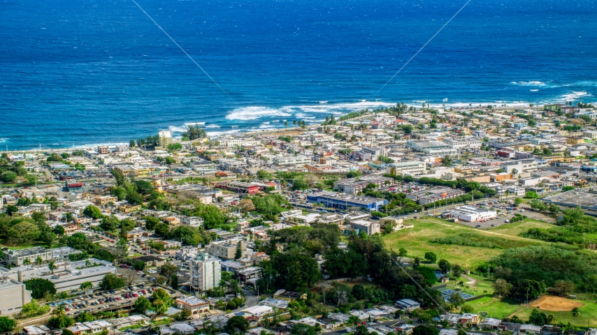 Coastal community homes and apartment buildings, Arecibo, Puerto Rico  Aerial Stock Photo AX101_136.0000000F | Axiom Images