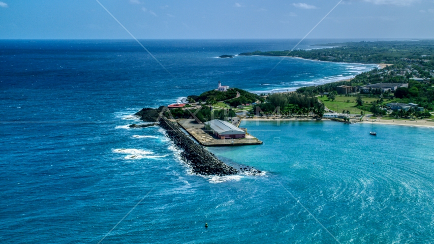 The Arecibo Lighthouse overlooking the blue Caribbean waters, Puerto Rico Aerial Stock Photo AX101_141.0000000F | Axiom Images