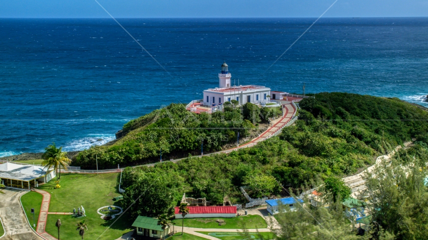 Arecibo Lighthouse with a view of the coastal waters of the Caribbean, Puerto Rico  Aerial Stock Photo AX101_144.0000000F | Axiom Images