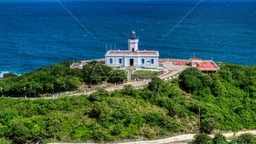 Arecibo Lighthouse beside the coastal waters of the Caribbean, Puerto Rico  Aerial Stock Photo AX101_144.0000277F | Axiom Images