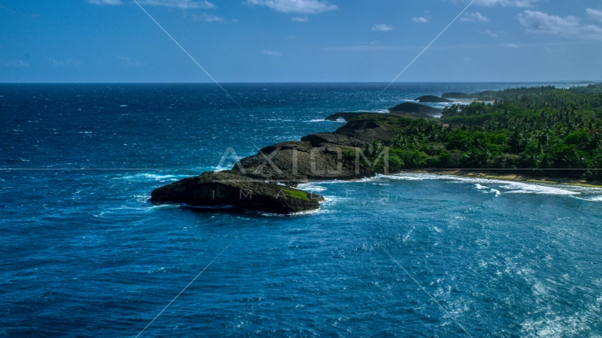 Rounded rock formations along the coast in Arecibo, Puerto Rico  Aerial Stock Photo AX101_160.0000000F | Axiom Images