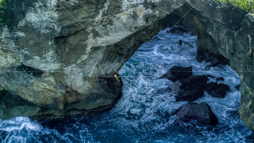 Water-filled sea cave on the coast, Arecibo, Puerto Rico  Aerial Stock Photo AX101_164.0000000F | Axiom Images