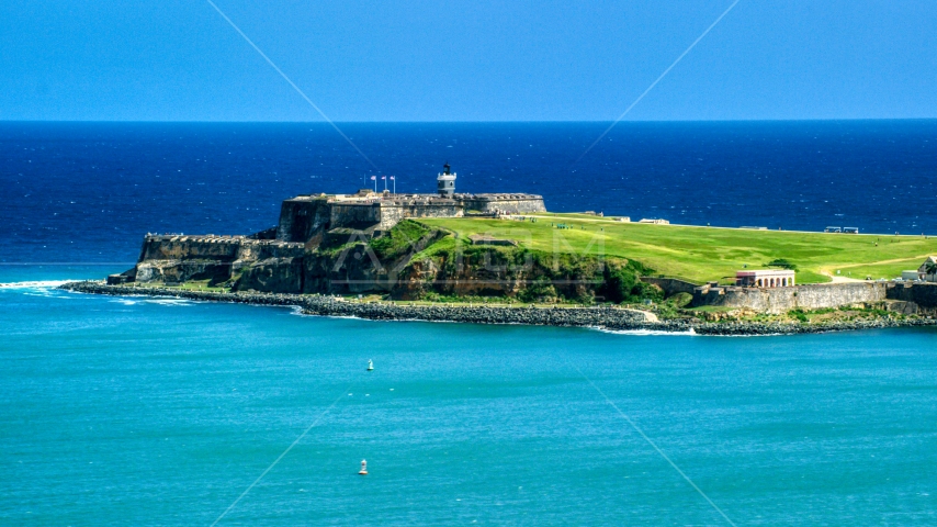 Fort San Felipe del Morro surrounded by crystal blue waters, Old San Juan, Puerto Rico Aerial Stock Photo AX101_235.0000000F | Axiom Images