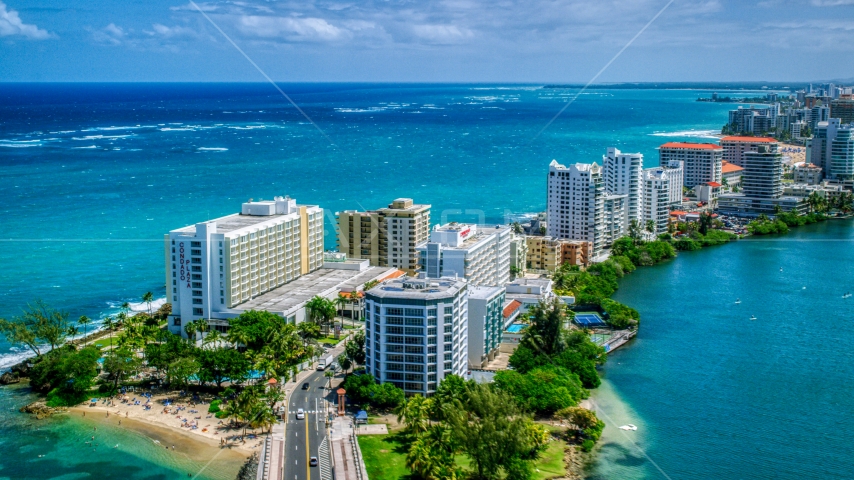 Hotels and high-rises on the coast, and crystal blue water, San Juan, Puerto Rico  Aerial Stock Photo AX102_002.0000000F | Axiom Images