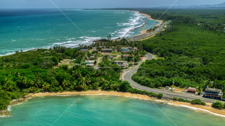 Beachfront homes beside a highway, Loiza, Puerto Rico  Aerial Stock Photo AX102_017.0000095F | Axiom Images