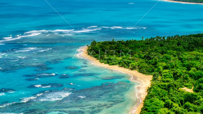 Reefs in the crystal blue waters along the Caribbean beach, Luquillo, Puerto Rico  Aerial Stock Photo AX102_054.0000000F | Axiom Images