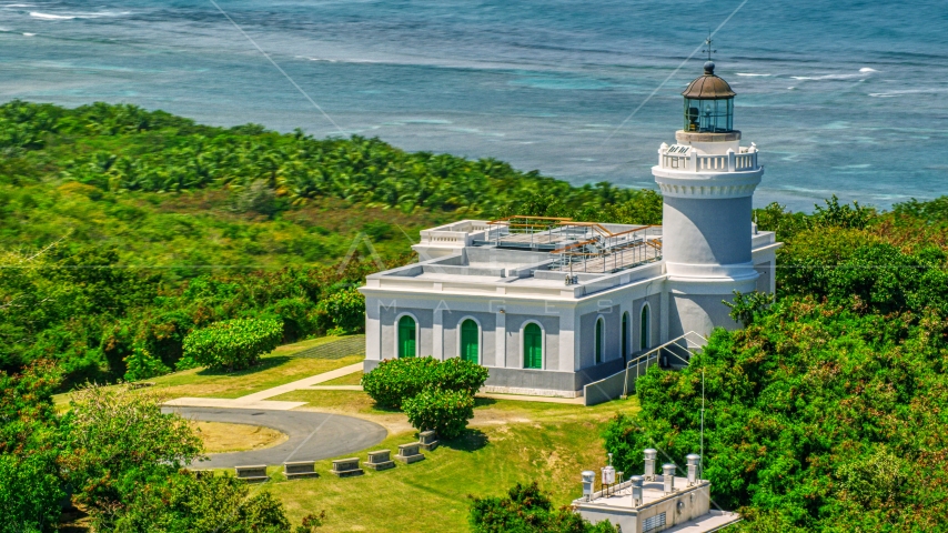 The Cape San Juan Light, a Caribbean lighthouse in Puerto Rico Aerial Stock Photo AX102_064.0000000F | Axiom Images