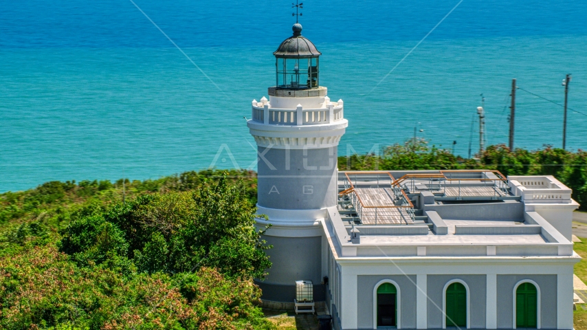 The Cape San Juan Light tower with ocean views, Puerto Rico Aerial Stock Photo AX102_067.0000000F | Axiom Images