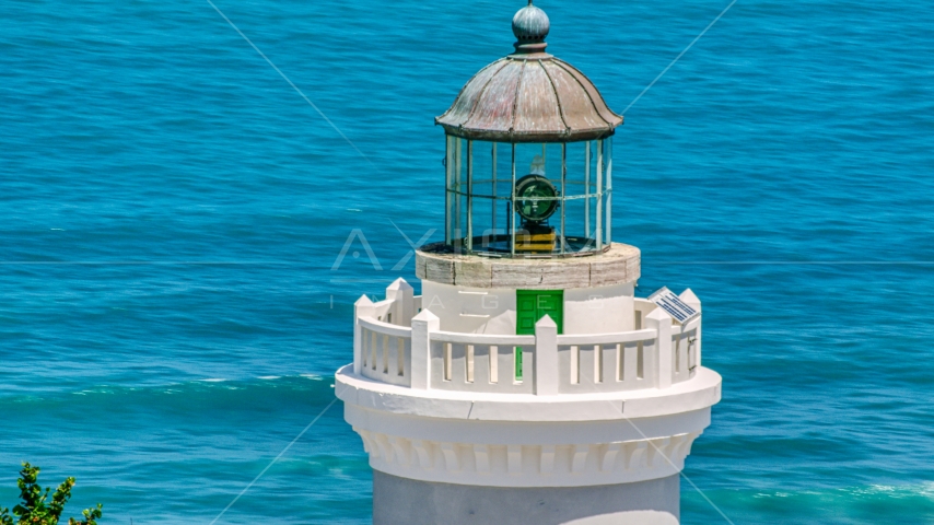 The top of Cape San Juan Light with views of clear blue waters, Puerto Rico Aerial Stock Photo AX102_070.0000071F | Axiom Images