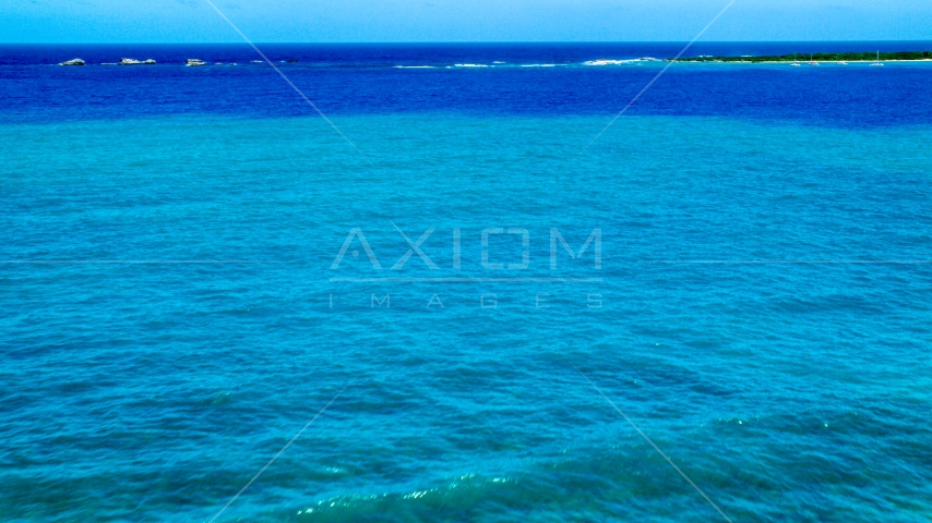 Tiny islands across blue Caribbean ocean in Fajardo, Puerto Rico  Aerial Stock Photo AX102_071.0000275F | Axiom Images