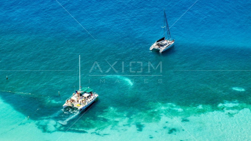 Catamarans in clear blue tropical waters, Rada Fajardo, Puerto Rico Aerial Stock Photo AX102_075.0000147F | Axiom Images