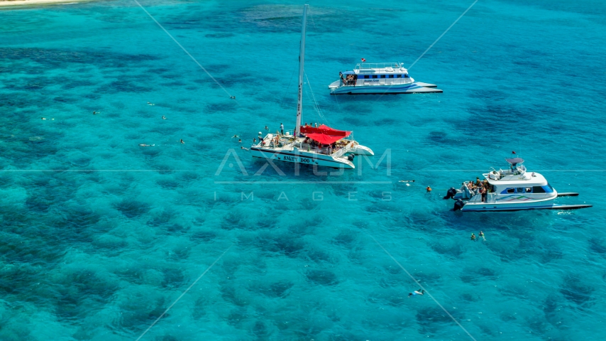 Three catamarans in clear blue water, Rada Fajardo, Puerto Rico  Aerial Stock Photo AX102_079.0000055F | Axiom Images