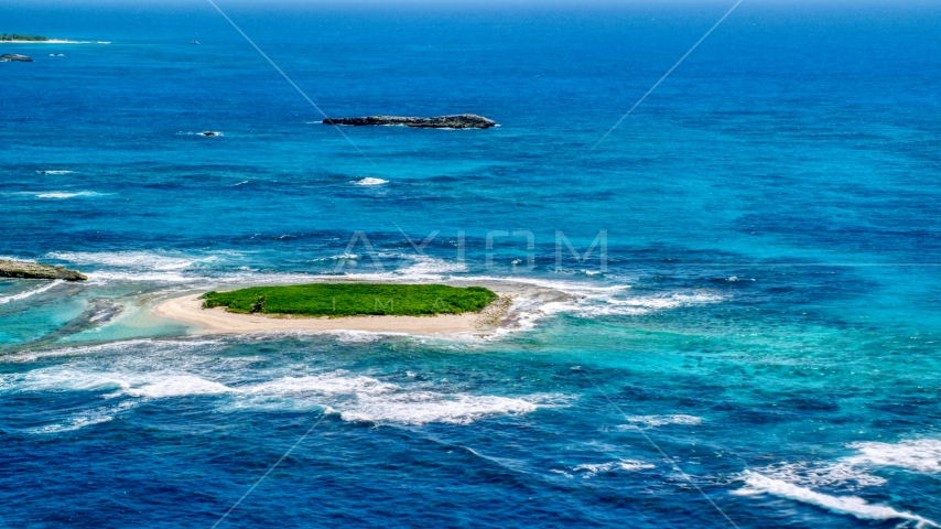 Tiny green island in tropical blue waters, Puerto Rico Aerial Stock Photo AX102_086.0000000F | Axiom Images