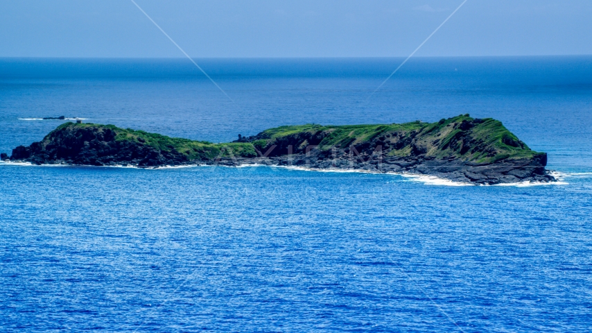 Small rocky green island in sapphire blue waters, Culebra, Puerto Rico  Aerial Stock Photo AX102_104.0000000F | Axiom Images